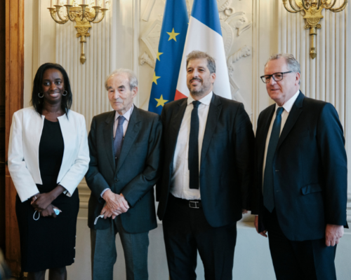 Aminata Raphael and Badinter at a meeting in France